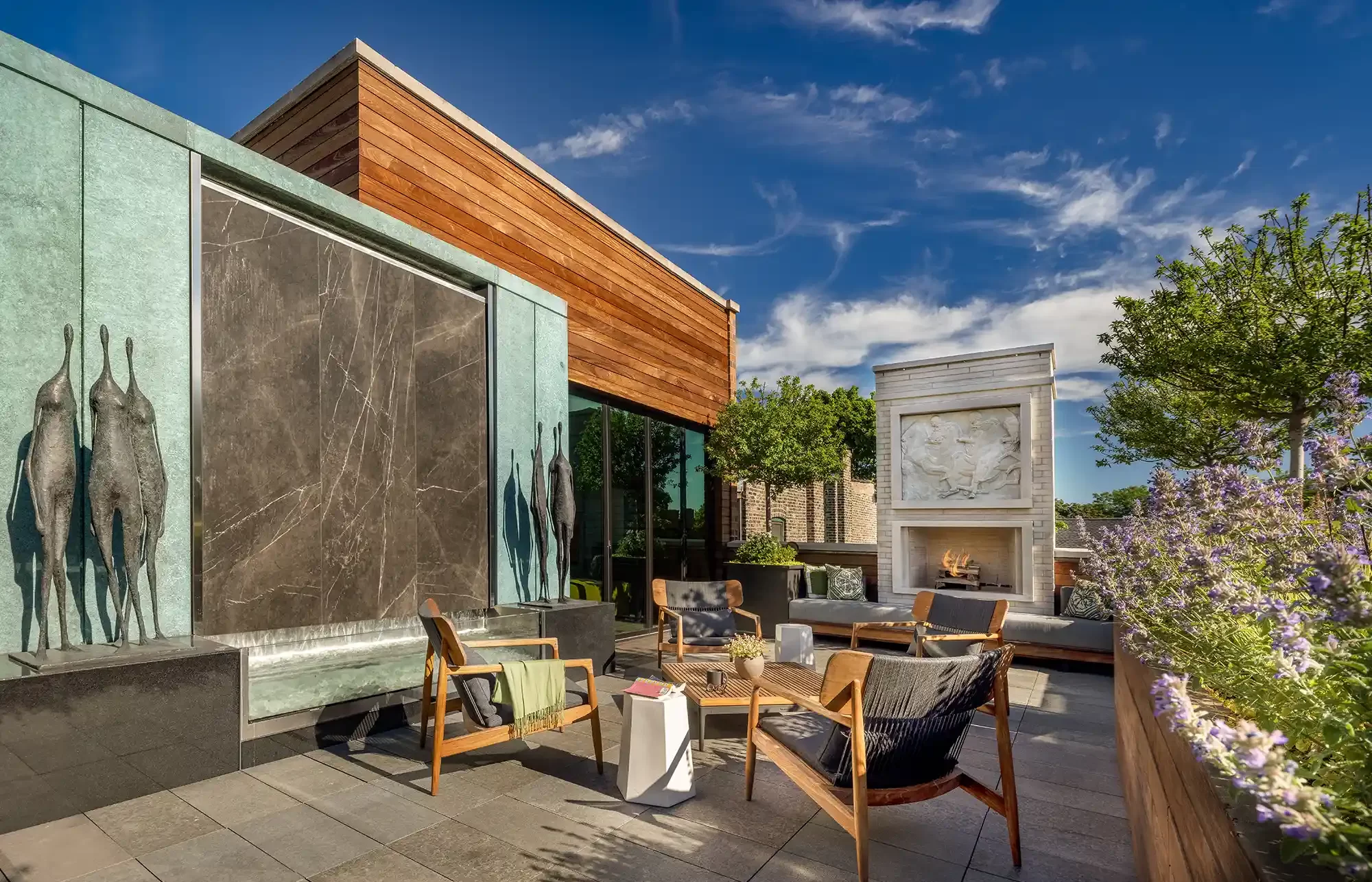 An outdoor patio with furniture and a fire pit.