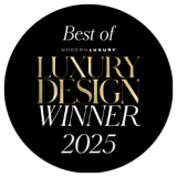 A black circular badge reads "Best of Modern Luxury Luxury Design Winner 2025" in white and gold text.